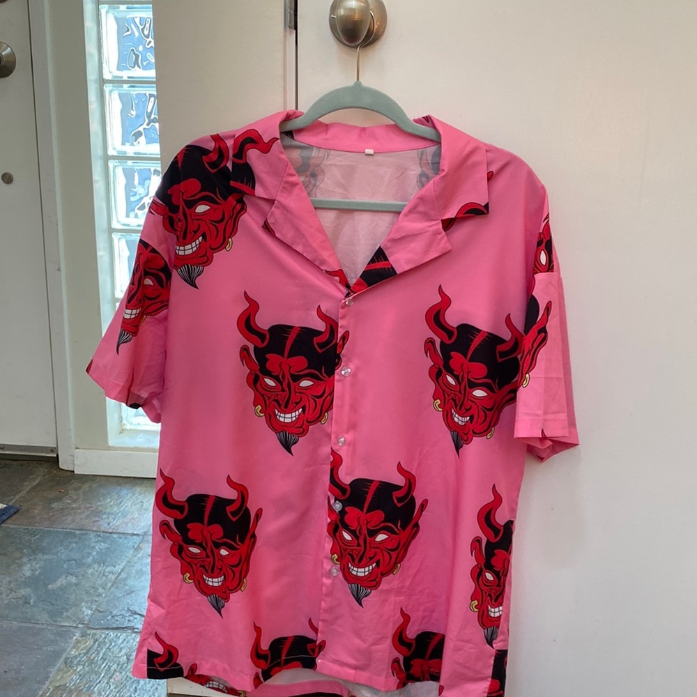 One of a kind- Pink button down shirt sleeve with devils